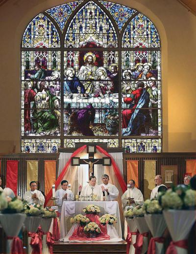 St. Ambrose parish in Fields Corner marked its centennial on Sunday with a Mass and luncheon. . 	Bill Brett photo